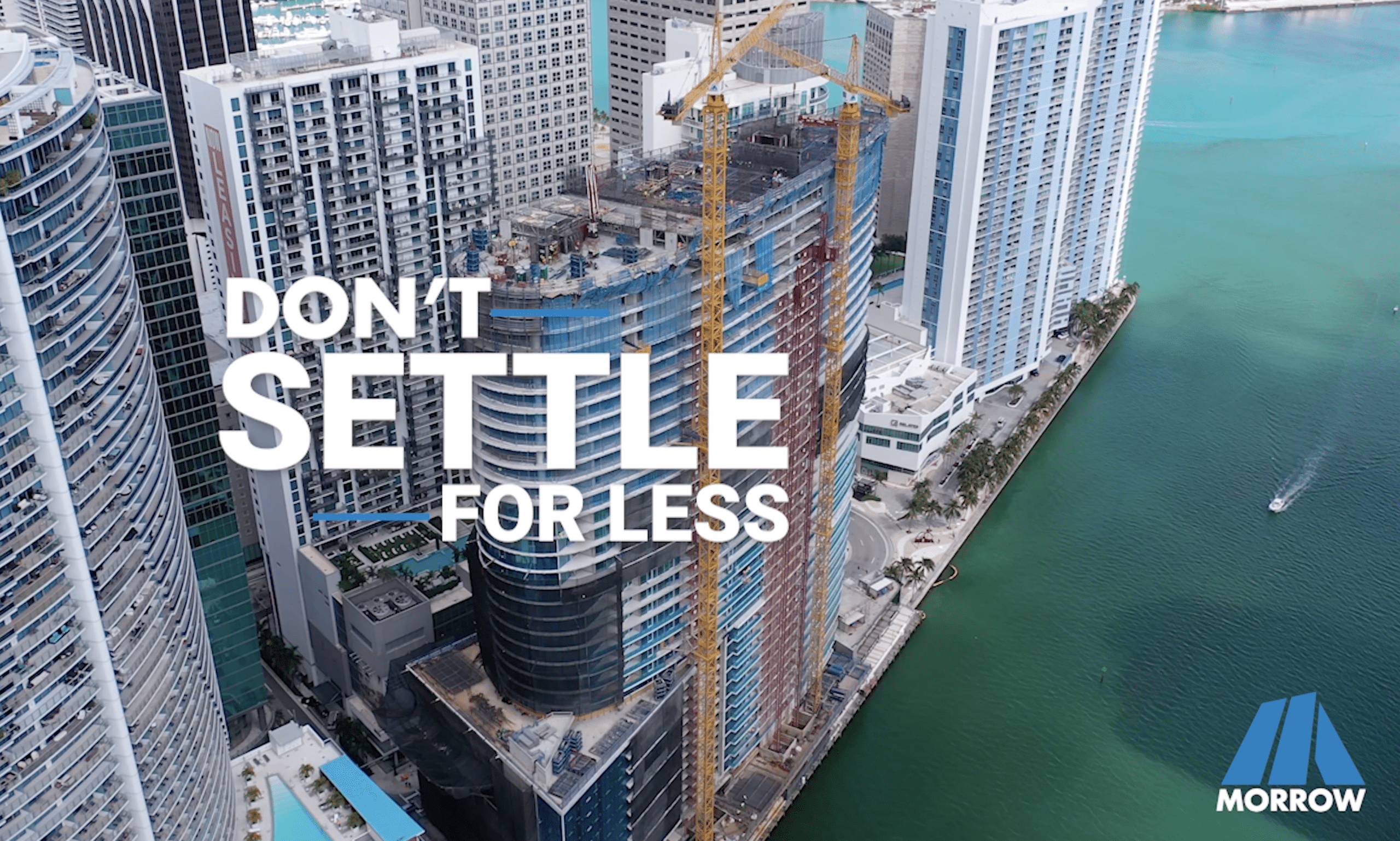 Construction site with motivational text 'Don't Settle for Less'