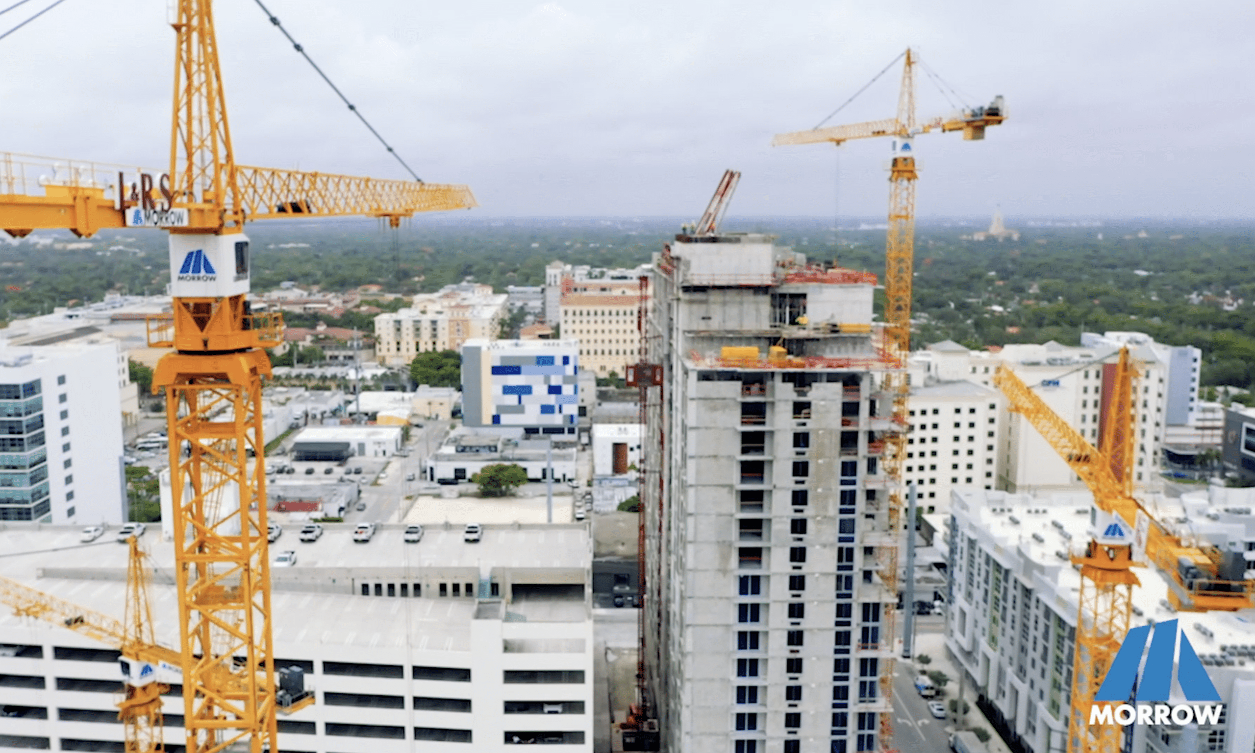 Construction site with cranes and high-rise building